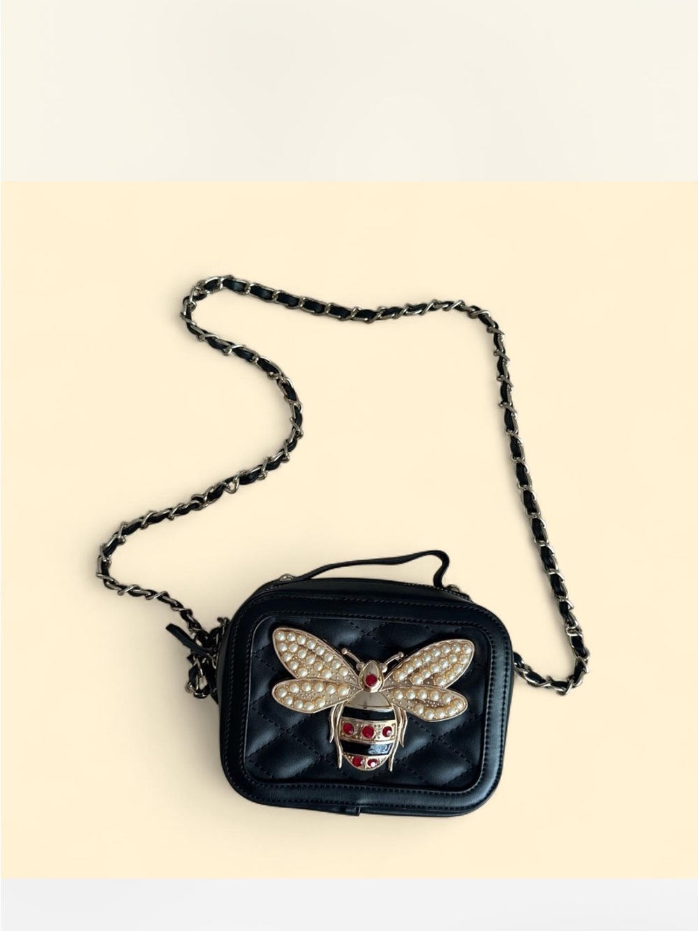 Chloe K Black Quilted Crossbody Bag with Pearl Bee Accent